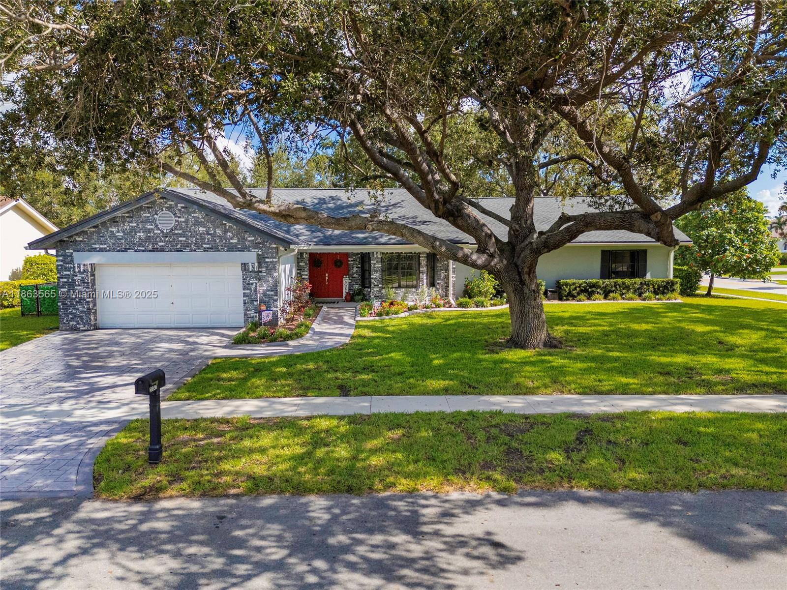 Welcome to this beautifully maintained 4-bedroom, 2-bath home in the highly desirable Chapel Trail community of Pembroke Pines. Set on a private oversized 11,544 sq ft corner lot, this residence features a split floor plan, volume ceilings (no popcorn), large bedrooms with walk-in closets, and stylish porcelain wood-look floors. The updated kitchen boasts granite countertops, stainless steel appliances, new light fixtures, and a spacious breakfast area. A new Roof was installed in 2018, adding peace of mind. The fully fenced backyard offers plenty of room for entertaining, kids, or pets. Located in a top-rated school district and just minutes from US-27, this home perfectly blends comfort, style, and convenience. Don’t miss the opportunity to make it yours. Easy to Show