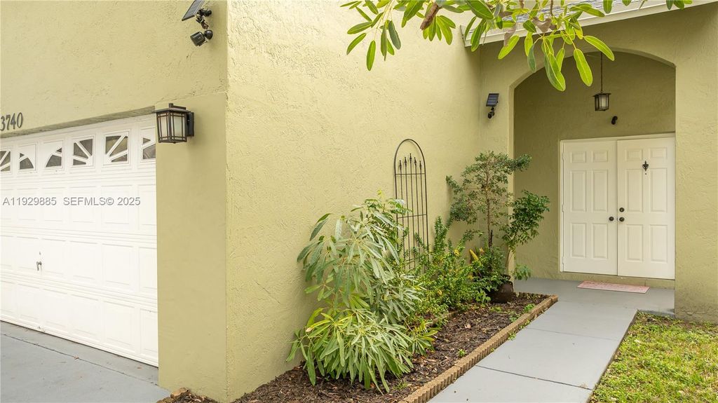 Photo of 3740 NW 23rd Pl, Coconut Creek, FL 33066 (MLS # A11929885)