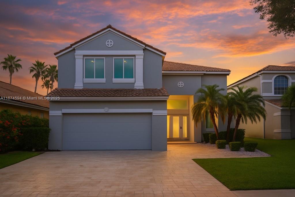Stunning 4-bedroom, 2.5-bath Weston home showcasing over $150,000 in upgrades. Enjoy a new travertine entryway and expanded patio, brand-new roof, hurricane-impact windows and doors, and remodeled kitchen with modern finishes. The home features new porcelain tile floors, all-white paint with sleek baseboards, stylish lighting throughout, and a state-of-the-art A/C with dual circuits, humidity control, and UV air purification. Additional highlights include a water softener, WiFi-enabled sprinkler system with new pump, tank, and pipes, modern insulated garage door with ultra-quiet wall mount, epoxy garage floor, EV charger, pavers, and custom closets. Move-in ready elegance!