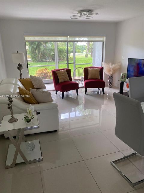 Photo of 8838 W Mcnab Rd #104, Tamarac, FL 33321 (MLS # A11988086)