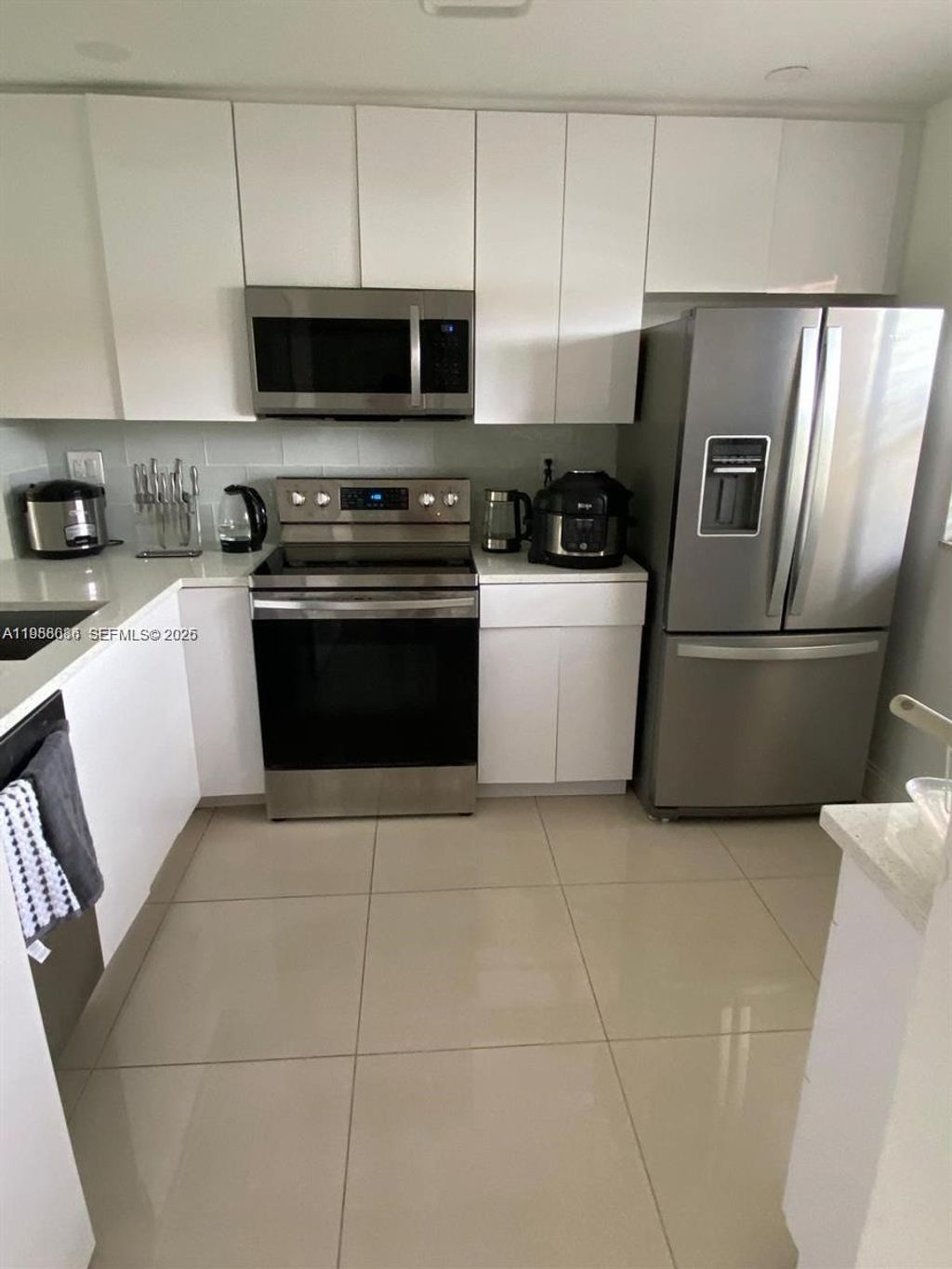 Photo of 8838 W Mcnab Rd #104, Tamarac, FL 33321 (MLS # A11988086)