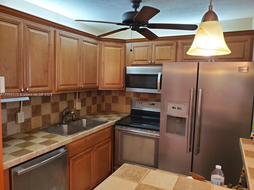 Beautiful Spacious 1 Bedroom/1 Bath, 2nd Floor condo  has renovated Kitchen custom wood cabinets lots of storage, granite ,Screened in Balcony  Centrally located minutes from EVERYTHING! Parks & Casinos, Restaurants, Doctors Offices, Shopping, Malls, Hospitals & much more.  Close to shopping, friendly Community (1 person must be over 55 years old) WALKING DISTANCE TO to the pool and very close to the fitness center and amenities. Tile floor, hurricane shutters in the front and in the back, buses to the clubhouse, watch entertainment at the theater, card games, billiard room, bungo, music, library, yoga, Pilates, tennis, pickleball, bocce ball, sailboat rentals, shuffleboard. very safe 55 and plus community with guards at the gate, Move in ready! Easy to show!
