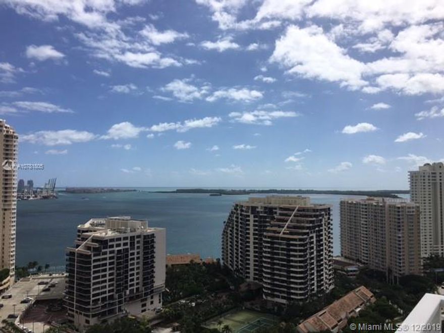 Beautiful Views from this corner unit, excellent and spacious 2 Bedrooms/2.5 baths, unit with Marble floors in the living areas, California style closets, new shades, granite counter tops in the kitchen and much more. Building in the prestigious Island of Brickell Key, with amazing amenities, remodel gym & party room. 2 tandem parking spaces!! Must see