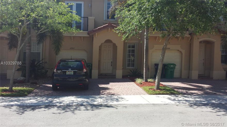 Spacious and light 2-story townhome, 3 bedrooms & 2.5 bathrooms, huge walking closet in master, tile floor in first level & carpet in second. Enjoy small fenced backyard perfect for family weekends. Located in the prestigious The Courts at Tuscany that features a beautiful pool and club house with gym, close to schools, shops and easy access to Turnpike and Palmetto expressways. It is a MUST SEE!