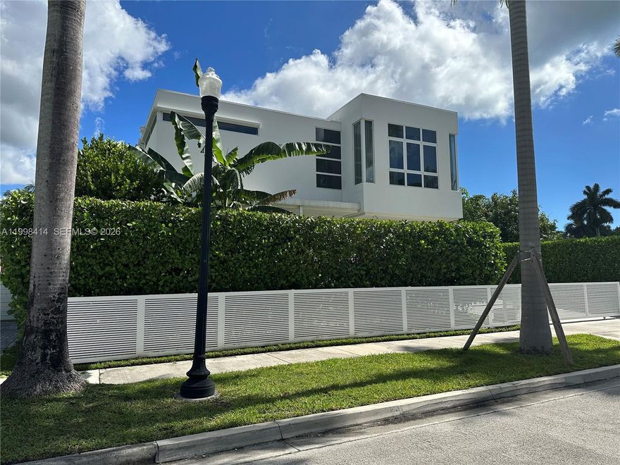 Modern 5-bedroom home offering the perfect blend of luxury and location. Situated near the lake with private boat access, this property is ideal for enjoying true waterfront living. Just a 5-minute walk to the beach, it offers the best of both worlds—peaceful lake views and easy ocean access. Spacious interiors, contemporary design, and abundant natural light create an inviting atmosphere throughout. Built entirely with solid concrete construction, including roof and intermediate slab, providing durability and peace of mind. Equipped with a natural gas generator for added reliability. Generous living areas, ideal for both everyday living and entertaining. Prime location close to dining, shopping, and top amenities.Please text listing agent and submit proof of funds prior to scheduling a showing.