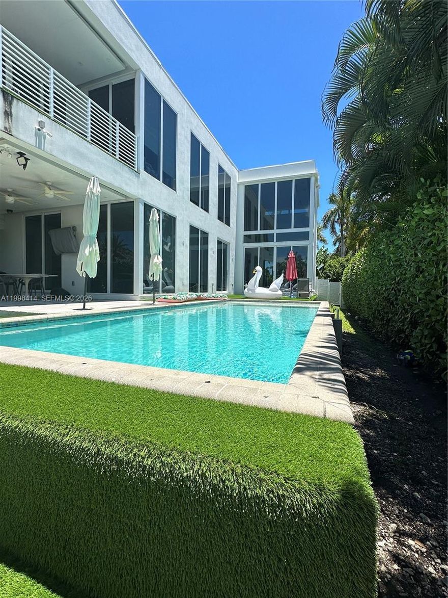 Modern Luxury Living in Hollywood Lakes – Concrete Construction, Walk to Beach & Boat Access
This exceptional 5-bedroom residence offers a rare combination of modern design, structural integrity, and prime location in the heart of Hollywood Lakes. Built entirely with full concrete construction—including roof and intermediate slab—this home provides unmatched durability, storm resistance, and long-term peace of mind.
Designed for both everyday living and entertaining, the home features expansive open spaces, abundant natural light, and seamless indoor-outdoor flow. High ceilings and clean architectural lines create a bright, sophisticated atmosphere throughout.
The outdoor area is ideal for South Florida living, with a heated pool and spa, spacious patio, and private setting perfect for relaxing or hosting. Located just a short walk from the beach and offering access to boating, this property delivers the ultimate coastal lifestyle without the premium of direct waterfront pricing.
Additional features include a natural gas generator for home backup power, generous living areas, and a highly desirable location close to dining, shopping, and top amenities.
A rare opportunity to own a modern, structurally superior home in one of Hollywood’s most sought-after neighborhoods.Please text listing agent and submit proof of funds prior to scheduling a showing.