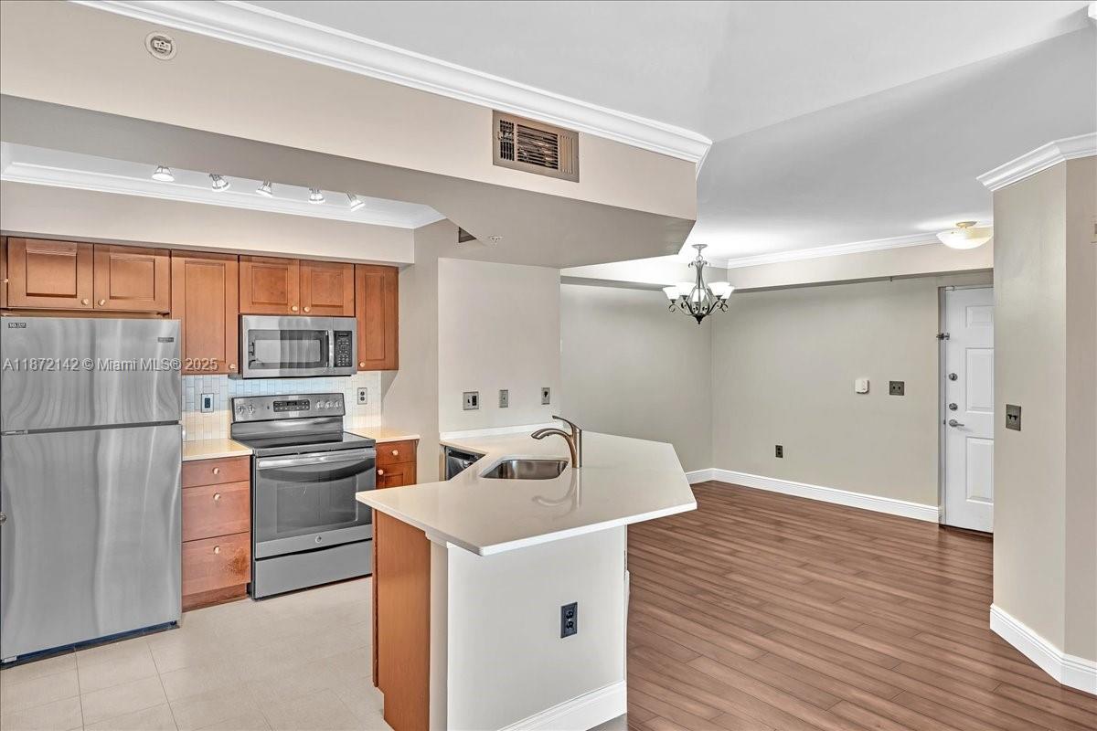 Make this beautiful 2-bedroom, 2-bathroom condo with a 1-car detached garage at Portofino at Jensen Beach your next home! This one-of-a-kind condo is a true find, located in a wonderfully appointed and centrally located gated community. It features hardwood floors, crown molding, quartz countertops, stainless steel appliances, built-in closets, and an oversized jetted bathtub. You'll also have access to the community's resort-style amenities, including a 24-hour fitness center with indoor racquetball, a heated pool, a jacuzzi, and a tennis court. All of this is located just minutes from the beaches, Treasure Coast Mall, downtown Jensen, specialty shops, and restaurants, making it a prime location for convenience and leisure.