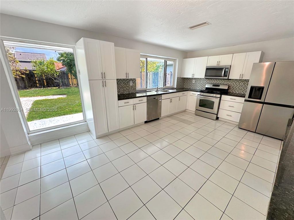 Photo of 9574 NW 19th Pl, Sunrise, FL 33322 (MLS # A11992884)