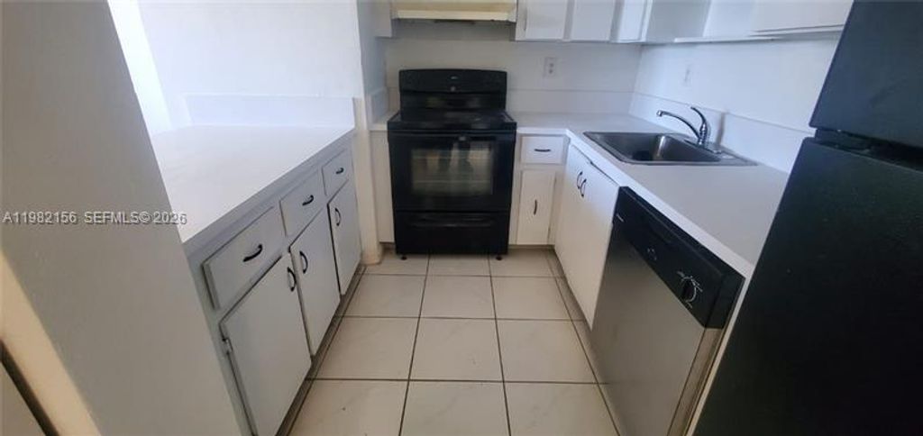 Photo of 5861 NW 16th Pl #309, Sunrise, FL 33313 (MLS # A11982156)