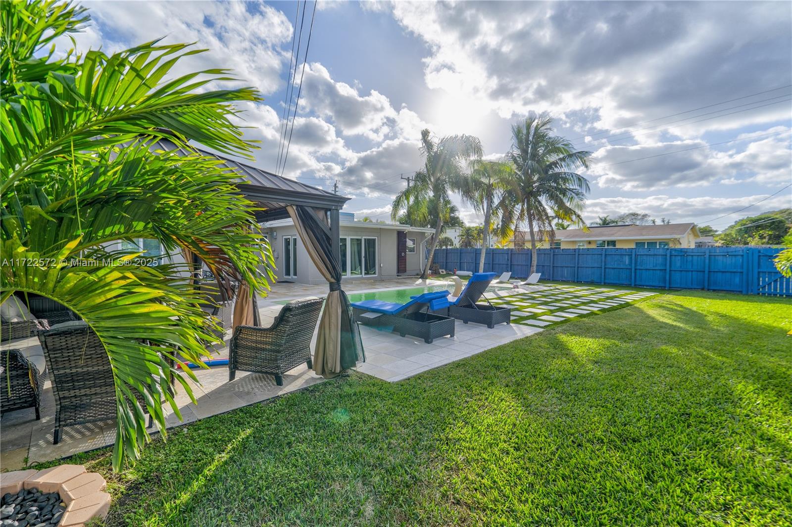 Welcome to this stunning 4-bedroom, 3-bathroom pool home situated on a spacious corner lot a stone's throw from the beach! This beautifully upgraded property boasts a newer metal roof and impact windows and doors, offering peace of mind and energy efficiency. Every upgrade has been thoughtfully completed with permits, ensuring quality and compliance. Inside, you’ll find a modern and elegant design, perfect for entertaining or relaxing. Step outside to enjoy your private pool, surrounded by ample outdoor space. Conveniently located near shopping, top-rated restaurants, and the casino, this home offers the perfect blend of luxury and lifestyle in an unbeatable location. Plenty of parking and no HOA!