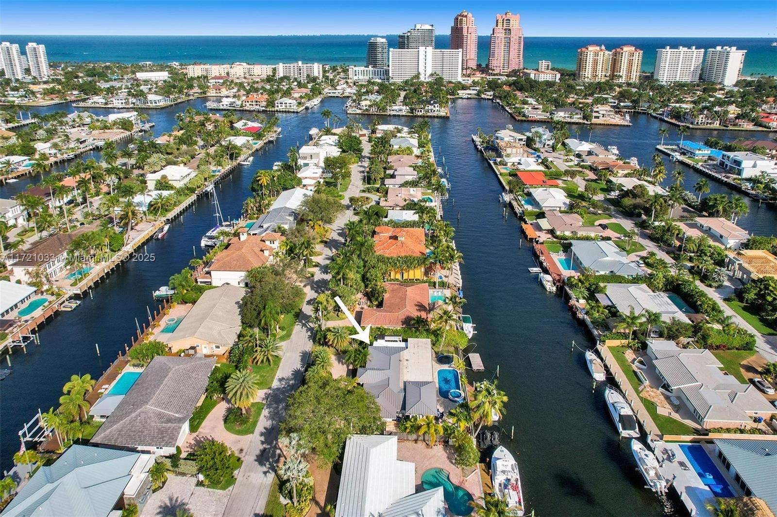 Welcome to your exclusive modern CORAL RIDGE WATERFRONT ESTATE with breathtaking water views, a true boater’s haven with a 100'seawall & 30ft dock. This architectural gem features impact windows & doors, sophisticated 4x4 porcelain flooring & seamless open-concept kitchen, Viking appliances, quartz countertops and elegant living space with LED lighting throughout, all overlooking the shimmering pool and canal. Master Suite with direct water view and exceptional large walk in closet. An entertainer's dream awaits with the expansive 24x12 covered patio, soaring ceilings, illuminated bar, sleek beverage cooler with lush & meticulously landscaping and 11 car parking, ensuring seamless hosting for any gathering. Steps from Galleria Mall, pristine beaches, fine dining, Bayview Elementary, parks.