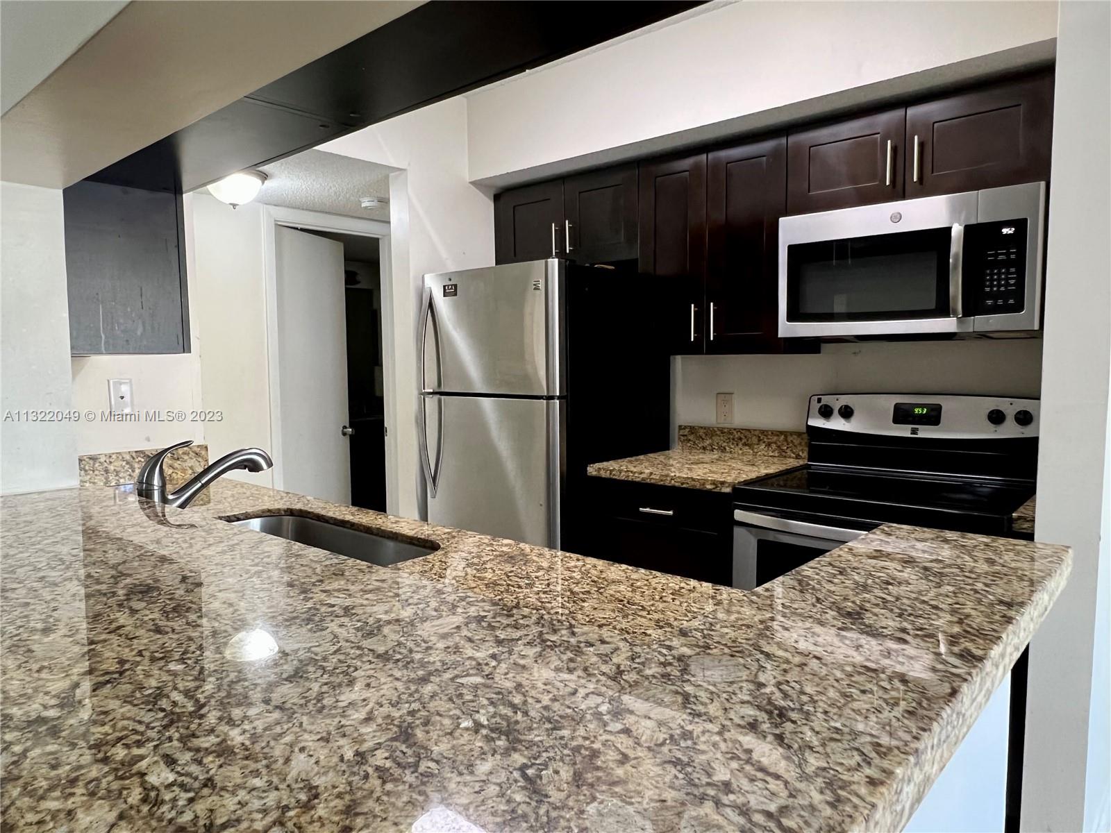 Most spacious 1Bed/1Bath unit the building. Conveniently located on the first floor. Kitchen with stainless steel appliances and granite countertop. Tile on main floor and modern laminate in bedroom. Large walk-in closet. Separate laundry room with full size washer and dryer. Screened balcony. Gated community featuring heated pool, fitness room, tennis court, Volleyball court. Water included in rent. Fast move-in.