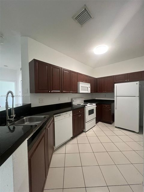 Photo of 7200 NW 177th St #206-7, Hialeah, FL 33015 (MLS # A11933376)