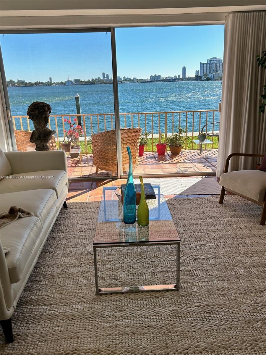 PHOTOS COMING SOON
Beautiful ground floor corner waterfront 2 bedroom 2 bathroom updated apartment in much sought after North Bay Village. Split bedroom floorplan with updated modern bathrooms and kitchen. Sliding doors from your living room to your private balcony overlooking the water. Pool and lounge area/courtyard and dock a few feet away. Laundry just outside your kitchen door. Building recertification complete. No special assessments. Resident parking permit spaces at front of building. Walk to shopping and restaurants. Tranquil Island Living