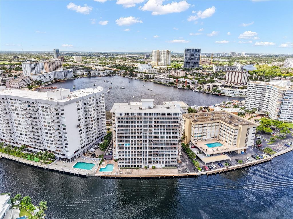 Photo of 121 Golden Isles Dr #803, Hallandale Beach, FL 33009 (MLS # A11993327)