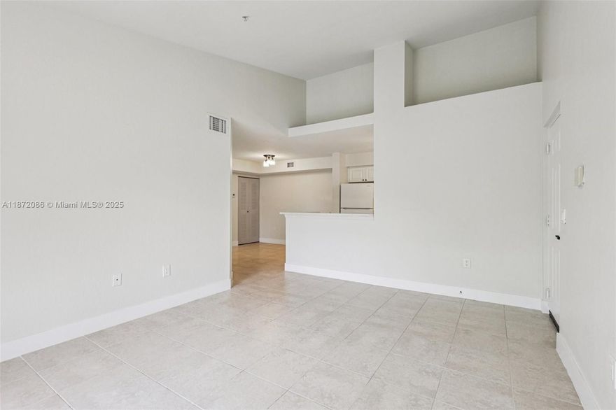 FINANCE WITH ONLY 5% DOWN. RESERVES IN THE BANK. UPDATED ROOF AND WINDOWS. This mint-condition residence offers 1,126 SqFt. of living space with high ceilings, a brand-new A/C unit, and a new stove. Freshly painted with upgraded baseboards, light fixtures, kitchen cabinetry, and bathrooms. Enjoy full-impact windows and sliding doors, plus a spacious primary suite with en-suite bath and large walk-in closet. Private balcony with storage included. Vista Trace is a gated community with 24/7 security, a new roof, community pool, and convenient access to US-1, the Turnpike, shopping, dining, and more. Comes with 1 assigned parking space plus 1 guest parking. Surrounded by exciting future developments including Arbors at Leisure, Homestead Sports Complex, and upcoming infrastructure projects.