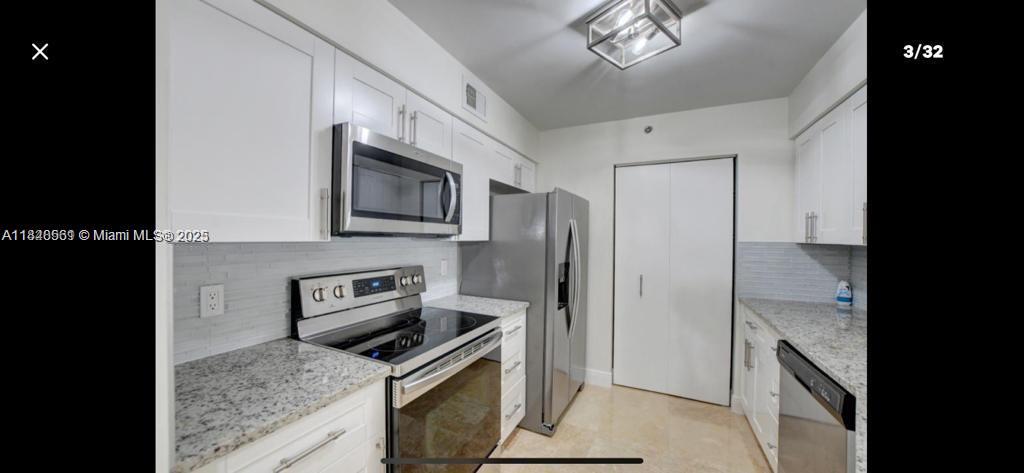 Wonderful 3 bedroom 2 bath condo in 24 hour guard gated community. This first story condo has a stainless steel appliances, granite kitchen counters top, custom closets, and laminate floors in the three bedrooms, and marble floors in living areas. Very well maintained community, landscaping and security. Tennis court and playground for children, heated pool and spa, fitness center and clubhouse. Close to Town Center Mall and few minutes from the beach