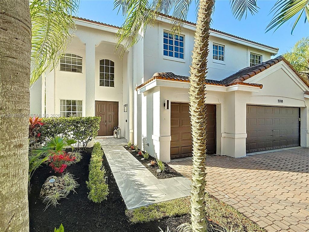 Photo of 1598 Sandpiper Cir, Weston, FL 33327 (MLS # A12008395)