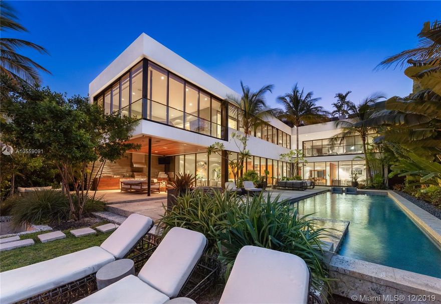 The epitome of ultra-modern luxury waterfront! Built in 2014, this stunning home features an eye-caching yet functional design with ample open spaces & wall-to-wall sliding glass doors that completely open, creating the ultimate indoor-outdoor experience. High-end finishes in natural tones & splendid scenery of Biscayne Bay embrace the living areas, oasis-like pool deck, & 2,000-SF roof top deck with summer kitchen– capturing 360-degrees of breathtaking views. Inside, a state-of-the-art kitchen sits between the living, formal dining, & family room – all opening to the pool deck featuring a spa & patio with a summer kitchen. Exquisite master with custom-built closets & lux bath - brilliantly designed for seamless connection between the indoor & outdoor. Actual city of this home is Miami.