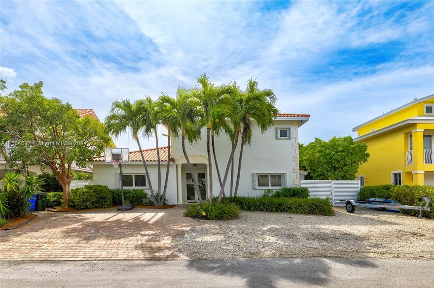 Venetian Shores boater's haven in Islamorada. 70 feet of pristine canal frontage, providing ample space for your small and large watercraft. Swimming pool and large Tiki, surrounded by tropical landscaping. Inside offers over 2700 SF living space. Inside, the ground level entry invites you to the living area, dining room and spacious kitchen, along with two bedroom suites. Upstairs are two primary bedroom suites, each with balcony access. Experience world-class sport fishing, kayaking, snorkeling, diving, and other water adventures. Easy access to the Atlantic Ocean and Florida Bay from this boater's paradise at Mile Marker 86 in Islamorada, Florida Keys.