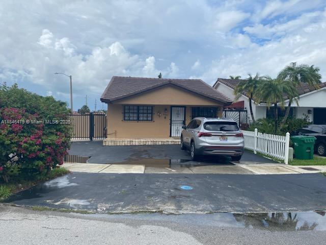 CORNER, 1 STORY HOME IN HIALEAH GARDENS. 2 OVERSIZED BEDROOMS CLOSE TO SHOPS, RESTAURANTS, GREAT SCHOOLS AND MAJOR ROADWAYS. FRESHLY PAINTED. NO OWNERS ASSOCIATION OR FEES. LARGE KITCHEN AND FAMILY AREA WITH ENCLOSED LARGE ROOM AT THE BACK THAT RUNS THE WIDTH OF THE HOME. NEW ROOF, AIR CONDITIONING AND WATER HEATER. PLENTY OF STORAGE ON THE SIDE OF THE HOME FOR A BOAT OR RV. HOME IS PARTIALLY TENANT OCCUPIED ON A MONTH-TO-MONTH BASIS.