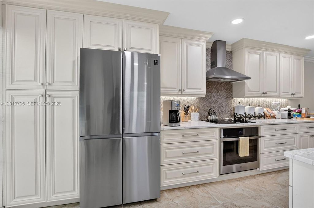 Photo of 8749 Belle Aire Dr, Boca Raton, FL 33433 (MLS # A12013795)