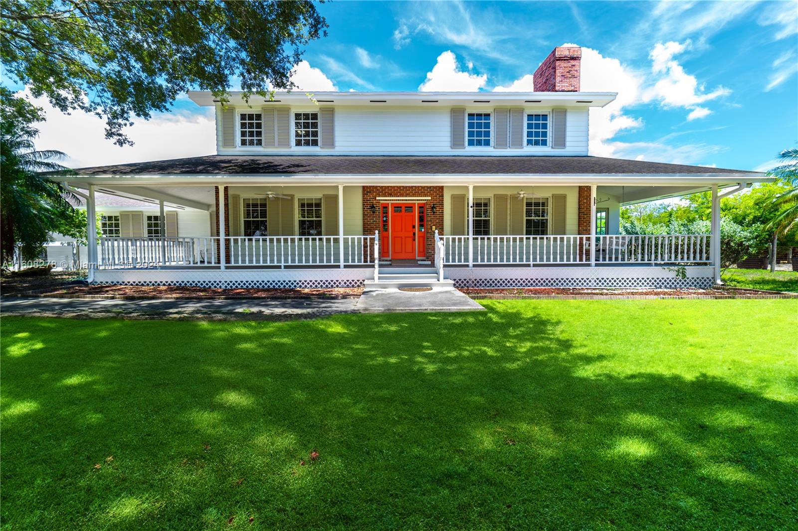 Dream Farmhouse in the Redlands, Homestead, Florida: Discover your dream home on 2.37 acres in picturesque Redlands, Homestead. This 5,000 sqft farmhouse offers 7 beds, 4 baths, and original hardwood floors. It's perfect for large families or investors. Features include a plant nursery, whole-home generator, modern kitchen with granite countertops, dual AC units, a cozy fireplace, game sun room, and wrap-around patio. Ideal for events, it's freshly painted and move-in ready. Don’t miss this unique opportunity—schedule a viewing today!