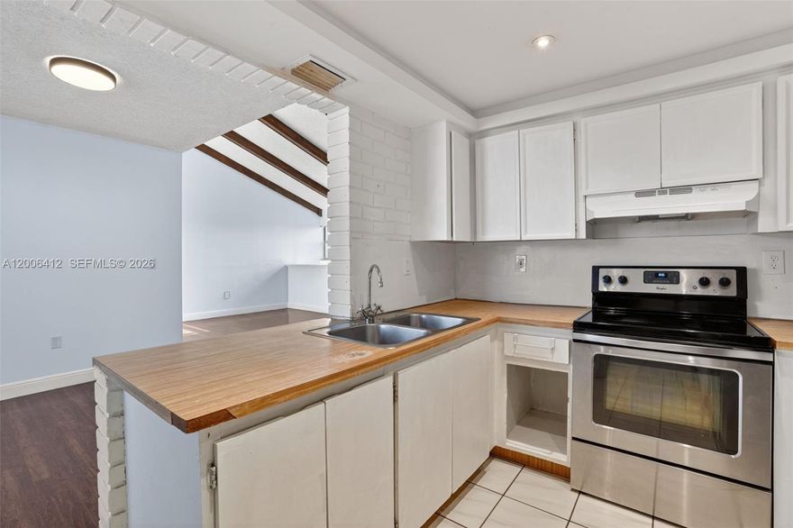 Beautifully updated 3-bedroom, 2-bath condo offering a spacious and airy layout with vaulted ceilings and wood floors throughout. Freshly painted and move-in ready, this home features hurricane impact windows, a new roof, and a newer A/C for peace of mind. Enjoy a well-maintained community with amenities including a pool, tennis courts, basketball court, and lots of guest parking. The unit includes two parking spaces—one assigned and an additional decal. Centrally located near major expressways, top shopping destinations, malls, and dining—this is convenience and comfort all in one!