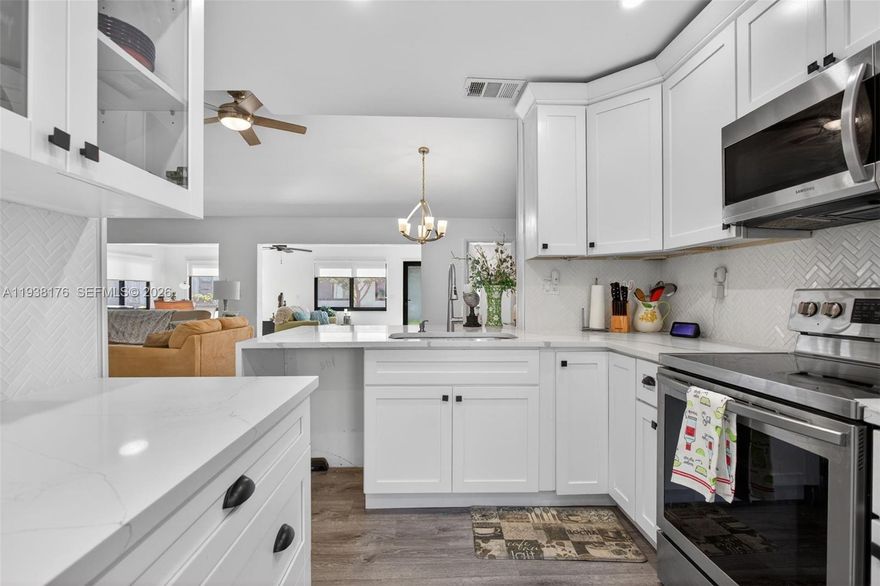 Welcome to your new beautifully updated home in the sought after 55+ community at The Meadows of Crystal Lake. This 2 bedroom, 2 bathroom home is being offered with a brand new roof installed in 2025, Over 1450+ of living sq footage with fully enclosed impact windows and doors! A Complete Interior Renovation with all new stainless steel appliances and Quartz countertops with replaced fixtures throughout the interior of the home. The Home has flat ceilings with freshly painted walls from trim to ceiling and within the master bedroom you'll find a custom built in closet as well as a fully remodeled bathroom including a new vanity, shower doors and recessed led lighting. Home also comes with a new washer & dryer residing in their own utility room and a separate garage with a newly replaced garage door. Come check out this beautiful residence in one of the most affordable and active 55+ communities including a community pool, spa and so much more all while being placed in a perfectly convenient location to all major highways, shopping, restaurants and a 15 minute drive from the closest beach.