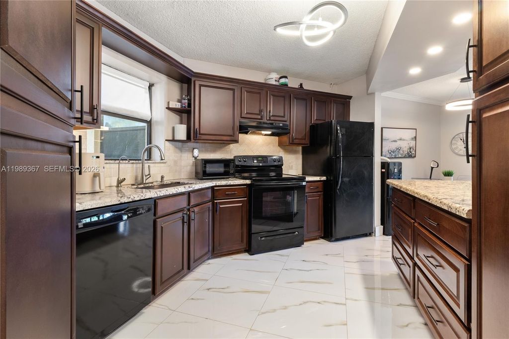 Photo of 6855 W Broward Blvd #201, Plantation, FL 33317 (MLS # A11989367)