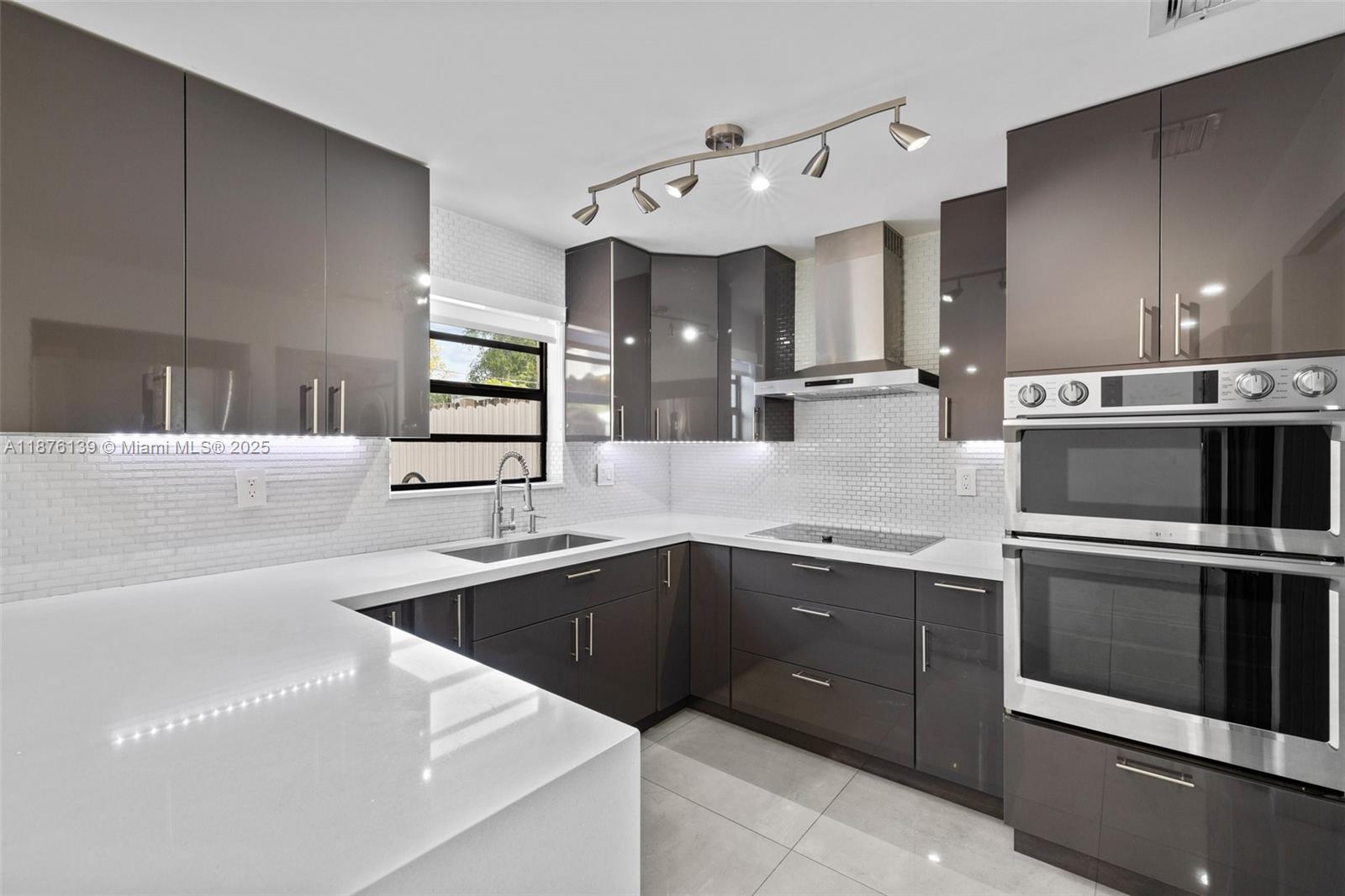 This stunning 3 bedroom, 2.5 bathroom townhome is a true gem! Big porcelain tiles will welcome you in throughout first floor entry. You'll also find the updated half bath, living room and kitchen. Kitchen has been fully updated & features custom cabinetry, stainless steel appliances, quartz waterfall countertop, wine cooler, oven/microwave duo, custom subway backsplash & laundry closet which offers the washer/dryer. Upstairs, you'll find the well-appointed bedrooms and bathrooms each featuring their own unique style and ample closets. Master bedroom is a true master and offers a balcony terrace. Townhome offers a private patio with a wooden gazebo and tool shed. Also comes with 2 parking spots. This property is a perfect combination of comfort and modern design!