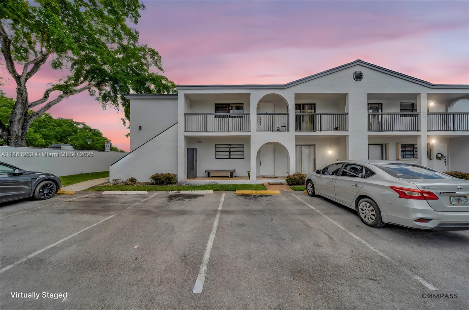 Beautiful 2BR/2BA – Move-In Ready! A versatile 3rd bedroom ideal for an office or guest room. NEW METAL ROOF, Enjoy HURRICANE IMPACT WINDOWS, private entrance, Volume Ceiling, laminate flooring throughout, updated lighting/fans, and custom closets in all bedrooms. The open kitchen offers ample cabinet space, bar seating, pantry, and appliances. The primary suite features a tub, shower, and WALK-IN custom closets. The oversized second bedroom includes mirrored closet doors and California closet system. In-unit WASHER & DRYER included. HOA includes, INTERNET, CABLE, WATER. Amenities: Pool, Basketball, Pickleball, Volleyball. Gym, Clubhouse, Child Play Area, Hand/Paddle ball & More! Furniture Negotiable. AC 2020. PROPERTY QUALIFIES FOR 100% FINANCE AND NO PMI. CALL TODAY!