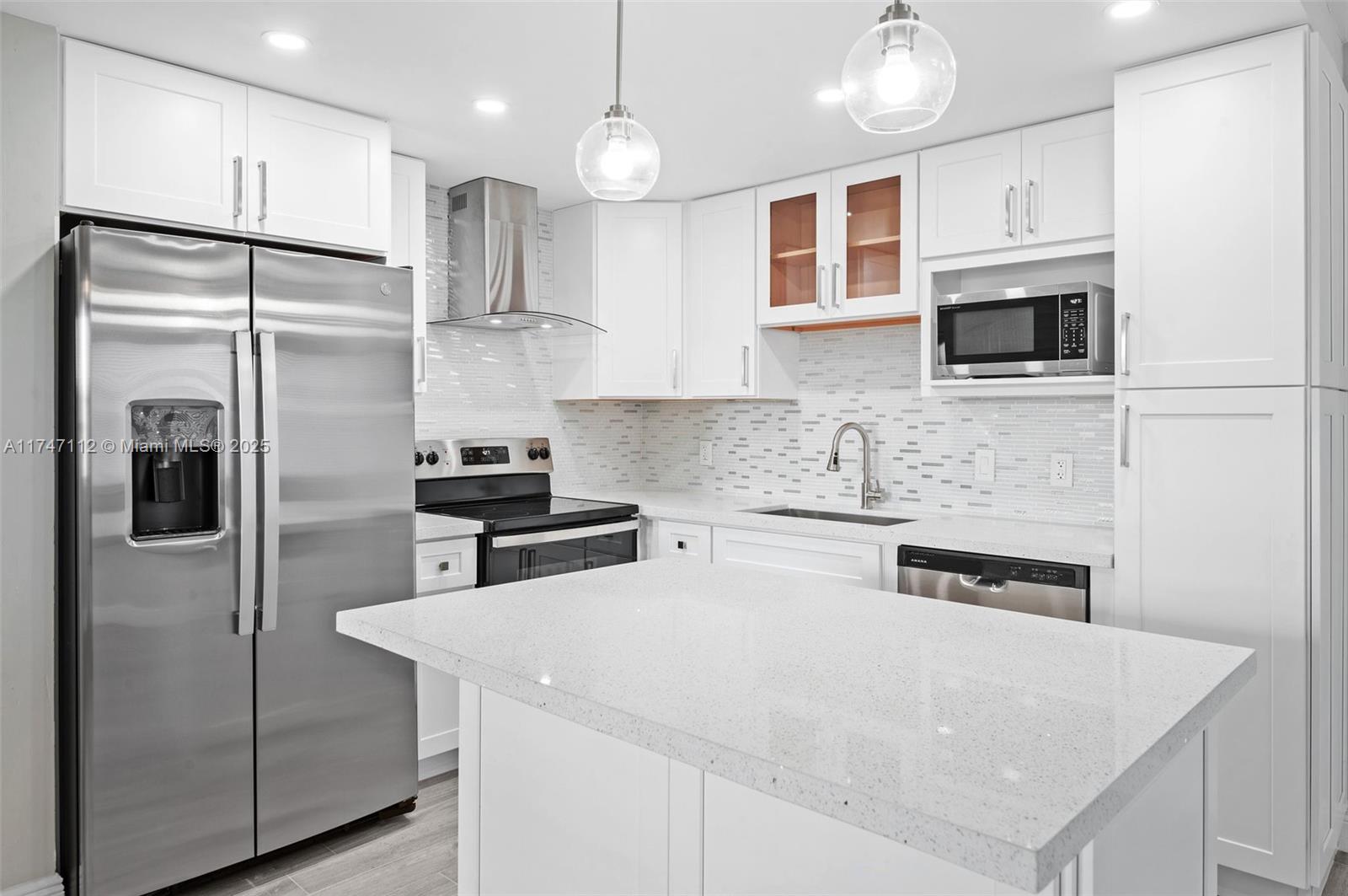 Must See! Meticulously renovated 1st-floor 1B/1.5B condo in the sought-after Kings Point & Country Club, a 55+ gated community. This stunning unit features new wood cabinetry in kitchen & bathrooms, quartz countertops, stainless steel appliances, modern baseboards, & energy-efficient LED lighting across an open floor plan. The oversized kitchen boasts an island, ample storage, generous counter space, & porcelain flooring throughout the entire unit. The sleek bathrooms include ultra-modern vanity mirrors with touch-activated lighting. Additional highlights: ceiling fans, window treatments, built-in closet storage, & a remote-controlled decorative fireplace. Enjoy an enclosed patio, new in-unit washer/dryer, access to pools, 3 multi-million dollar clubhouses, 2 executive golf courses.