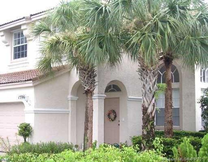 Towngate community Royal Bay this beautiful home with tile floors downstairs, wood flooring upstairs, laundry room downstairs next to 2 car garage, All bedrooms upstairs, has fenced back yard.