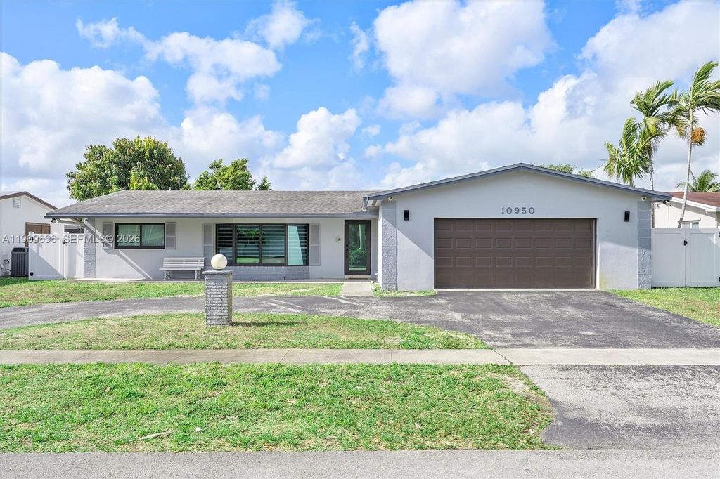 Photo of 10950 NW 16th Ct, Pembroke Pines, FL 33026 (MLS # A11969696)