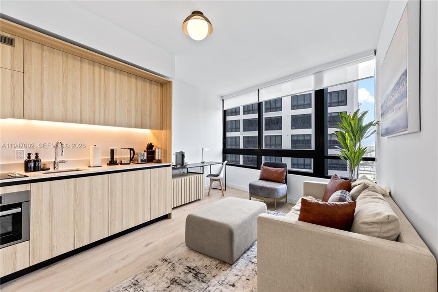 Experience luxury urban living at District 225, Miami’s premier full-service condominium designed for both residents and investors. This fully furnished 1-bedroom, 1-bath residence features 9 ft. ceilings, contemporary finishes, and smart-home technology. The gourmet kitchen is equipped with custom Italian cabinetry and premium Bosch appliances, including a paneled refrigerator, dishwasher, built-in convection oven, and cooktop. Additional features include built-out closets, a full-size washer/dryer, and a spa-inspired bathroom with Italian vanities and a rain shower.

District 225 was intentionally designed for short-term rental flexibility, allowing owners to host with ease. An on-site concierge team is available to assist with Airbnb operations and guest support—making this an exceptional opportunity for investors.

Residents enjoy resort-style amenities, including an expansive pool deck with bar and lounges, state-of-the-art fitness center, yoga and spinning studios, indoor basketball court, rock-climbing wall, racquetball court, full-service spa, and a dedicated co-working floor with private meeting rooms. The rooftop deck offers a plunge spa, fire pit, summer kitchen, and panoramic views of Downtown Miami and Biscayne Bay.

Prime location, luxury living, and turnkey rental capability—this residence at District 225 offers unmatched lifestyle and investment potential in the heart of Miami.