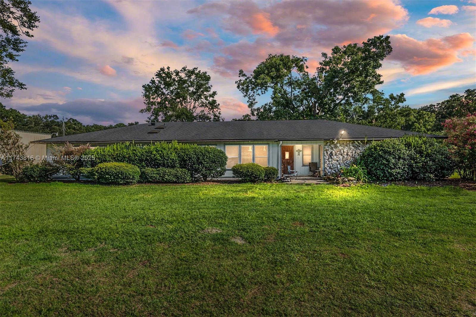 This 35.76-acre equestrian facility is a dream come true for horse enthusiasts. It features a 12,000 sq. ft., 40-stall barn with top-notch amenities, including a fly spray system, tack rooms, wash racks, and automatic watering. The property also boasts a 3,000 sq. ft. storage building, irrigated paddocks, miles of trails, a custom jump ring, a 150x250 arena, a round pen, and a cross-country course. Additionally, there are two apartments (1-bed and 3-bed) for immediate income potential. The property is conveniently located near major equestrian centers and has a shared gate to PHD Veterinary Services. Zoned for residential development, it offers endless possibilities.