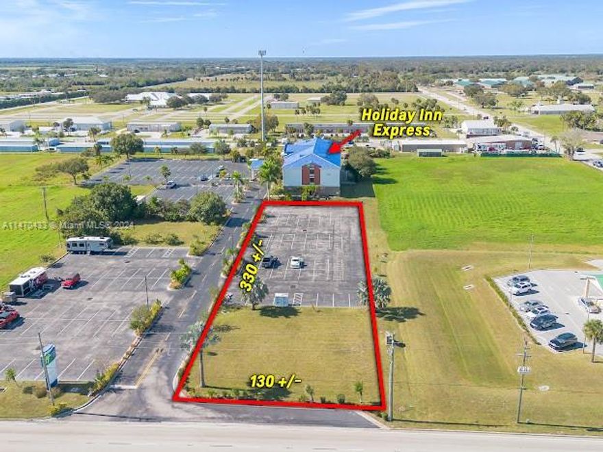 LOCATION LOCATION AND LOCATION. ONE ( 1 ) ACRE + / -  OUT PARCEL LOCATED IN FRONT OF HOLIDAY INN EXPRESS, LOCATED ON MAJOR HIGHWAY , HWY. 441 ( PARROTT AVE ), 4 LANES , NORTH & SOUTH ARTERY THRU THE COUNTY AND CITY OF OKEECHOBEE, FL. HOME DEPOT, WALMART, PUBLIX & THE LARGEST K.O.A.  SITE IN THE U.S.A. IS LOCATED ALL WITHIN A HALF MILE ( .5 ).  NEW STARBUCKS & DUNKIN  SOON TO BE DEVELOPED, WITHIN 1000 FEET. PRIME LOCATION FOR A NATIONAL CHAIN RESTUARANT.