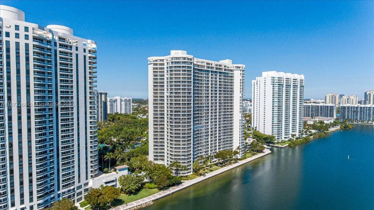 GREAT INVESTMENT OPPORTUNITY Stunning 4-bed, 3.5-bath corner unit at 7000 Island Blvd, Apt 1402, with recently updated floors, remodeled kitchen and ceilings, and new window treatments. Enjoy breathtaking city and bay views. Includes 3 bedrooms plus a den ideal for staff, guests, or storage. Modern finishes and access to all amenities: club, tennis courts, spa, pickleball, playground, restaurants, and marina. Rented through July 10, but can be sold with tenants in place.