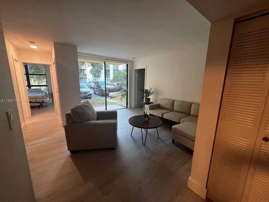 This charming ground-floor 2 bed/2 bath unit features a spacious open layout with new modern flooring throughout. You'll love the upgraded kitchen with granite counters and stainless steel appliances. The bedrooms features massive windows for incredible natural light. Enjoy indoor-outdoor living with a balcony patio opening to green space, plus the ultimate convenience of your own assigned parking spot right in front of your door. Perfect for first-time buyers or investors.