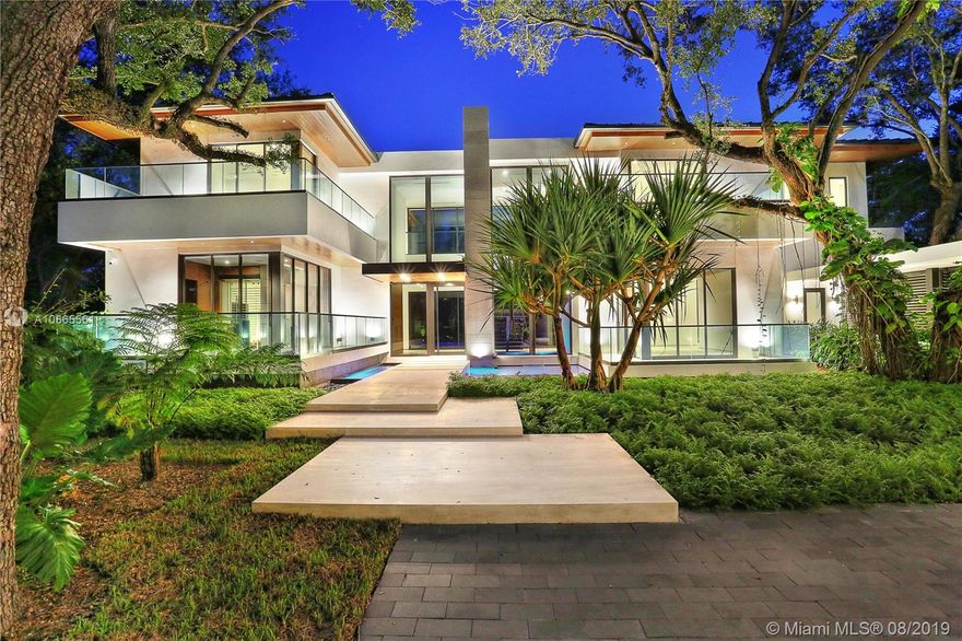 Nestled in the gated community of Hammock Lakes lives Hammock House, a stunning Tropical Modern Custom-Home curated by renowned Architect + Builder, Giorgio Balli. Hammock House was created with the intent to blend into its native landscape, voiding the line between exterior and interior spaces while prioritizing one’s privacy. The home sits deep into the site surrounded by several mature oak trees and its neighboring Hammock, guarded by a 6’ property wall. The home boasts large living spaces embellished with imported marble, granite and custom woodwork, encased by floor-to-ceiling windows welcoming natural light. Hammock House will be home to the sophisticated person who has an appreciation for crafted-function and ground-breaking design. All top-of-the-line finishes and appliances.