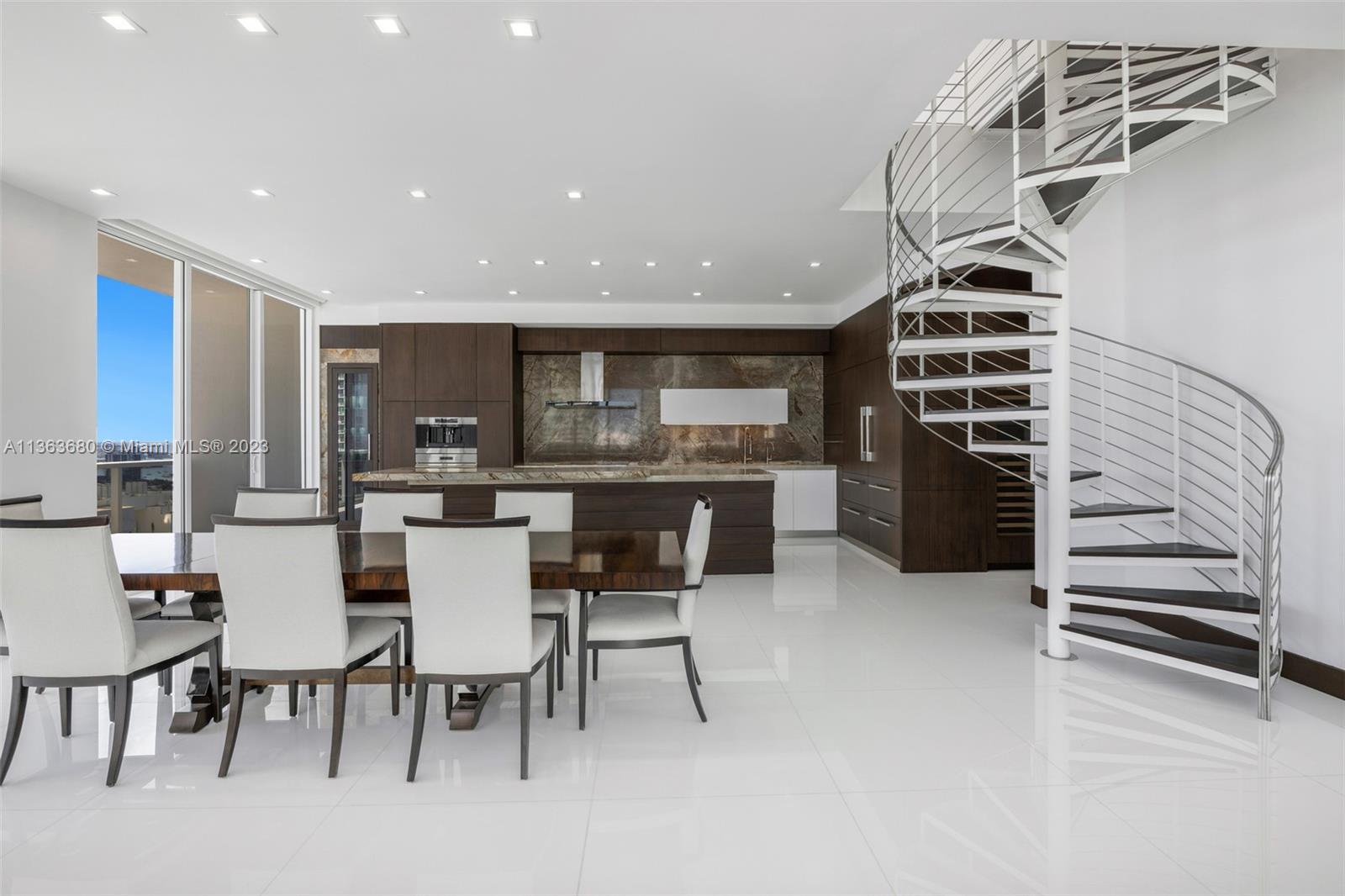 Completed remodeled two-story penthouse in the heart of East Edgewater with stunning panoramic water + city views boasting 2,832 SF of interior and a 1,512 SF rooftop plus terraces. With extreme attention to detail, this unique 4 bedroom + 5.5 bathrooms + Laundry + rooftop unit has been professionally designed and offers an expansive open floor plan with white glass tile flooring throughout and beautiful walls wrapped in wood. Custom gourmet kitchen with two large wine coolers. Featuring private elevator & foyer, high ceilings, 4 parking spaces, master suite with oversized his & her closets and his & her bathrooms, this penthouse is nothing short of luxury. Electronic blinds, Nest Thermostat, Security cameras, and much more! Boutique building complete with social room, pool, and more.