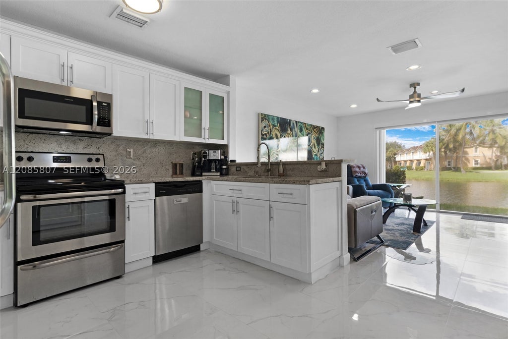 Photo of 12905 SW 31st Ct #TOWNHOUSE, Miramar, FL 33027 (MLS # A12085807)