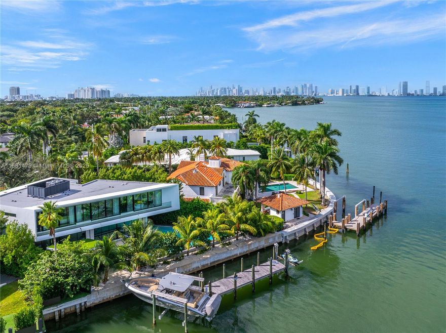Experience luxury waterfront living from this modern, 2022 built home on prestigious lower North Bay Road! This 6-bedroom, 5,100SF home is sited on an oversized 16,366SF lot with 101ft of waterfrontage, a private dock, boatlift, and immediate bay access. Inside, stunning open living spaces, Italian porcelain tiles, oak wood floors, floating staircase, sleek open kitchen with oak cabinetry, glass hood, & an oversized pantry. The chic primary suite boasts dual spacious closets and a midnight bar. Outside, a 78ft lap pool, summer kitchen, and lush landscaping create the perfect setting for lounging and dining on the water! Gated home with 2-car garage, located minutes to the trendy Sunset Harbour neighborhood, La Gorce Country Club, South Beach. BEST PRICED new waterfront in Miami Beach!