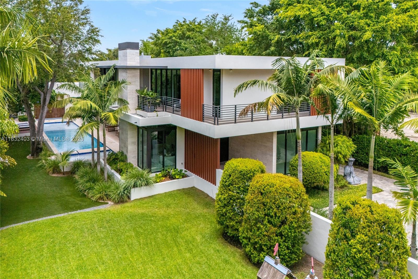Experience luxury living in this stunning home designed by renowned architect Cesar Molina. Nestled on a quiet, cul-de-sac street, this residence offers exceptional privacy and tranquility. Enjoy resort-style amenities including an elevator, a sparkling pool with a shallow beach entry, and a breathtaking waterfall wall cascading into the jacuzzi. The thoughtfully designed layout features 4 suites, a family room on the second floor, and 2 bedroom’s plus an office on the main level. Culinary enthusiasts will love the gourmet kitchen, equipped with Sub-Zero appliances, wine coolers, and a Wolf range. Indulge in spa-inspired bathrooms with premium Hansgrohe and Duravit fixtures.