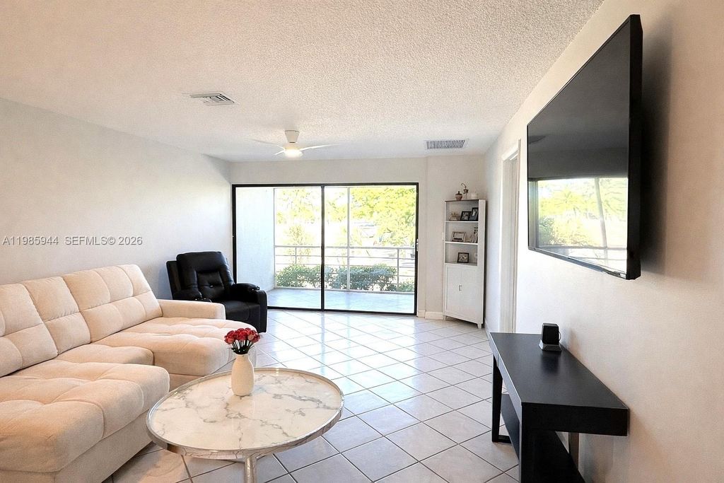 Photo of 7830 NW 33rd St #308, Davie, FL 33024 (MLS # A11985944)