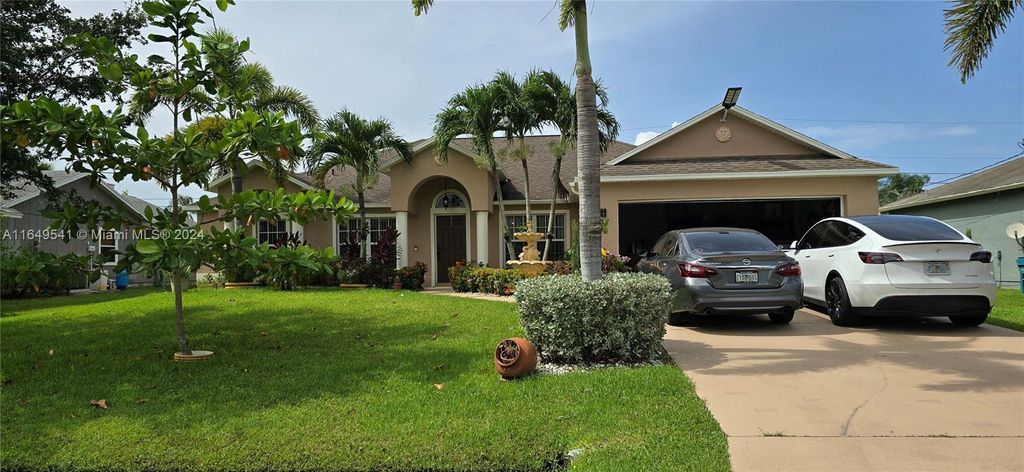 Photo of 1237 SW Malaga Ave, Port Saint Lucie, FL 34953 (MLS # A11649541)