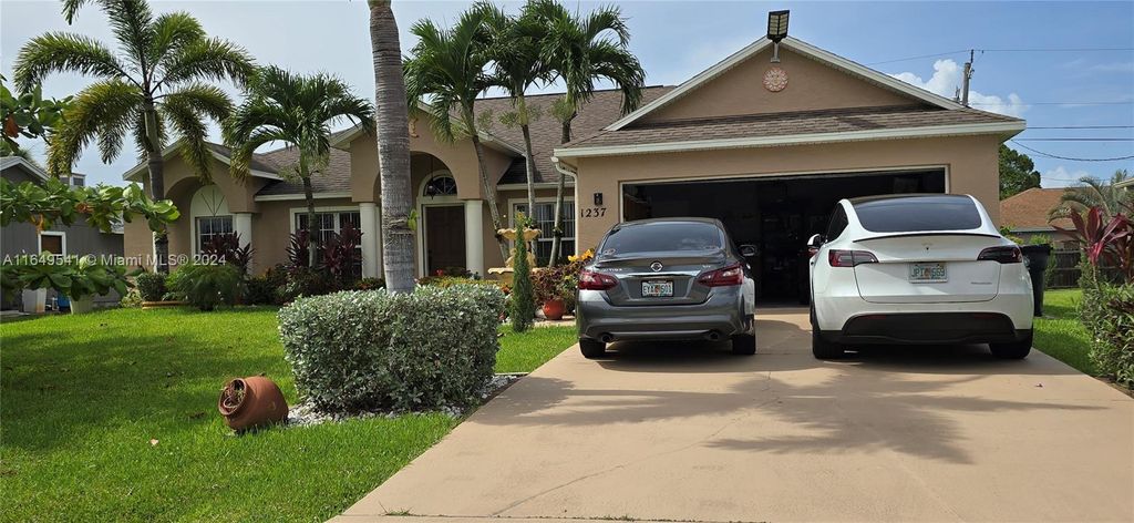 Photo of 1237 SW Malaga Ave, Port Saint Lucie, FL 34953 (MLS # A11649541)