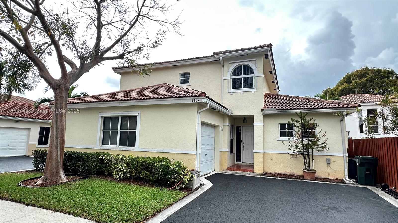 This exquisite 3 bedrooms, 2.5 bathrooms home is situated in Coco Palms, conveniently located across the street from the renowned Windmill Park in Coconut Creek. Equipped with BRAND NEW ROOF. The interior boasts a brand-new laminate floor, an electric range, and a refrigerator. The bathrooms have been updated, and the AC is 5 years old. Water heater was recently replaced in 2024. Additionally, a hurricane shutter has been installed for added protection. The interior has been freshly painted, and tall bay windows generously allow an abundance of natural light. Low HOA fee and a credit score of 650 is required.