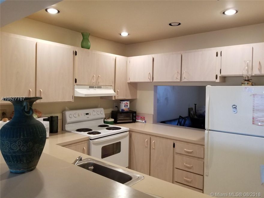 Spacious Condo in an exceptional Kendall Location! This centrally located Unit features 2 bedroom,2 bathroom and an extra room that could be the 3rd Bedroom or an office! Nice Kitchen with bar Top, Washer & Dryer inside the Unit, Ceramic tiles in living areas & wood floors in Bedrooms. Big Balcony with partial Lake View! Beautiful community Pool in the Complex!Walking distance to Parks,Regional Library,new Baptist Hospital and Shopping!